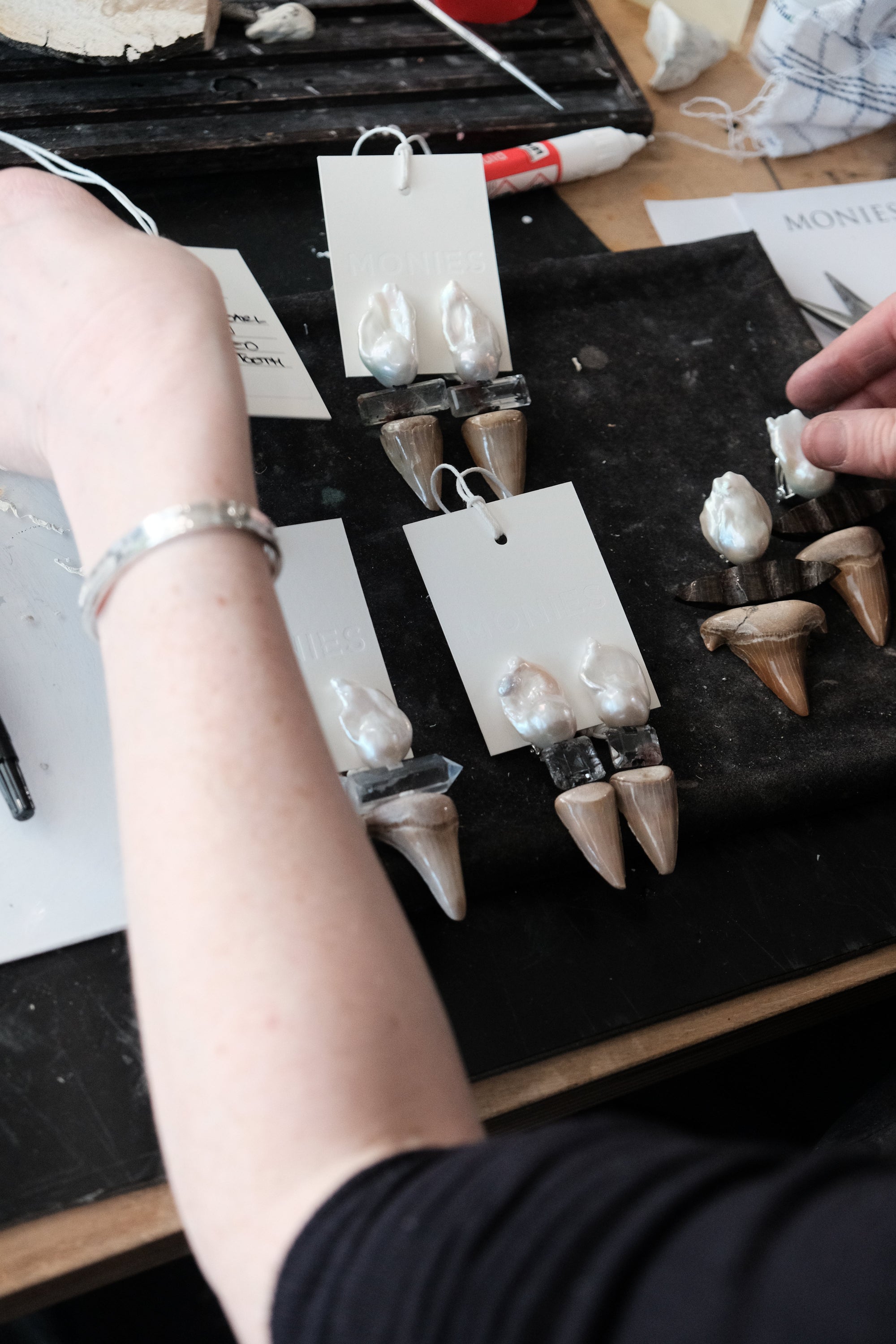 Earrings: pearl, quartz, fossilized shark tooth