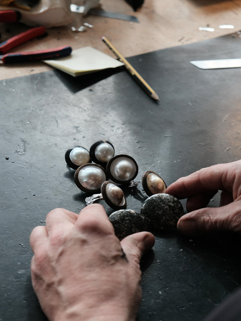 Earrings: baroque pearls, ebony