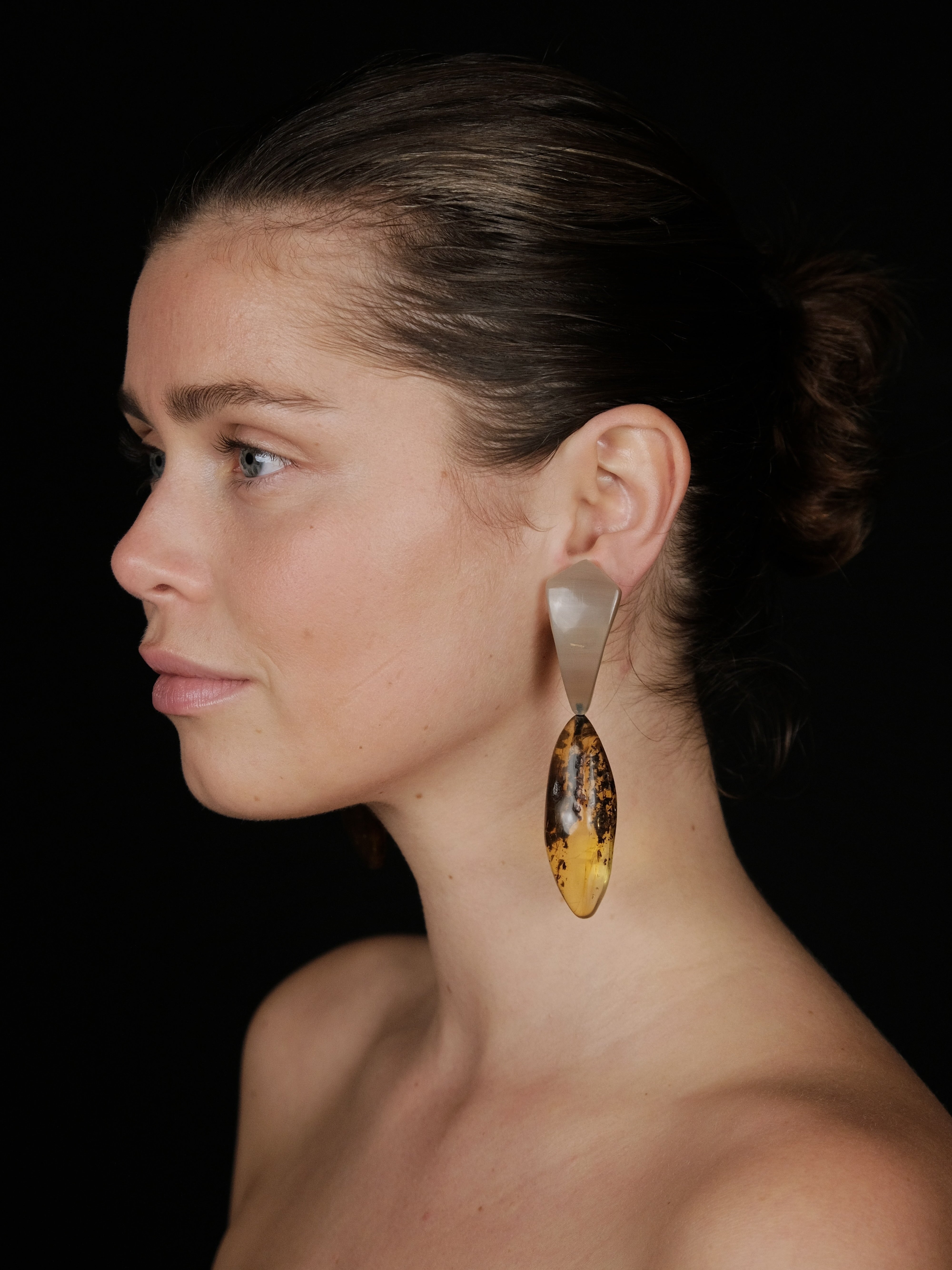 Earrings: horn, amber