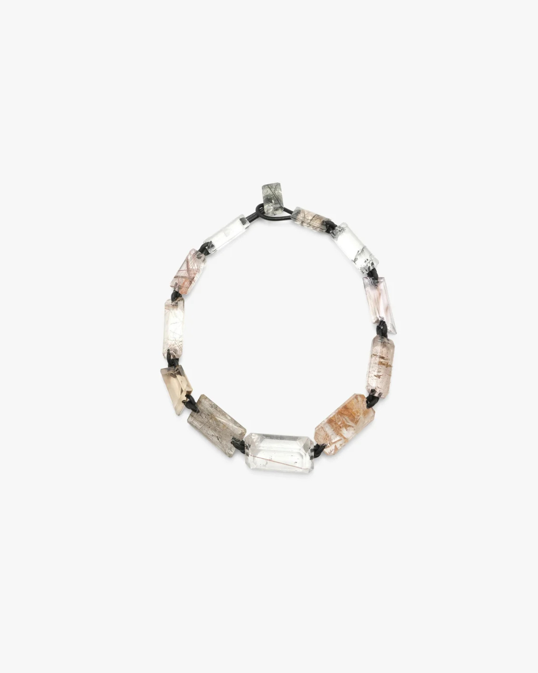 A beaded necklace featuring clear quartz, , and smoky brown stone segments separated by small black beads, displayed on a light gray background.