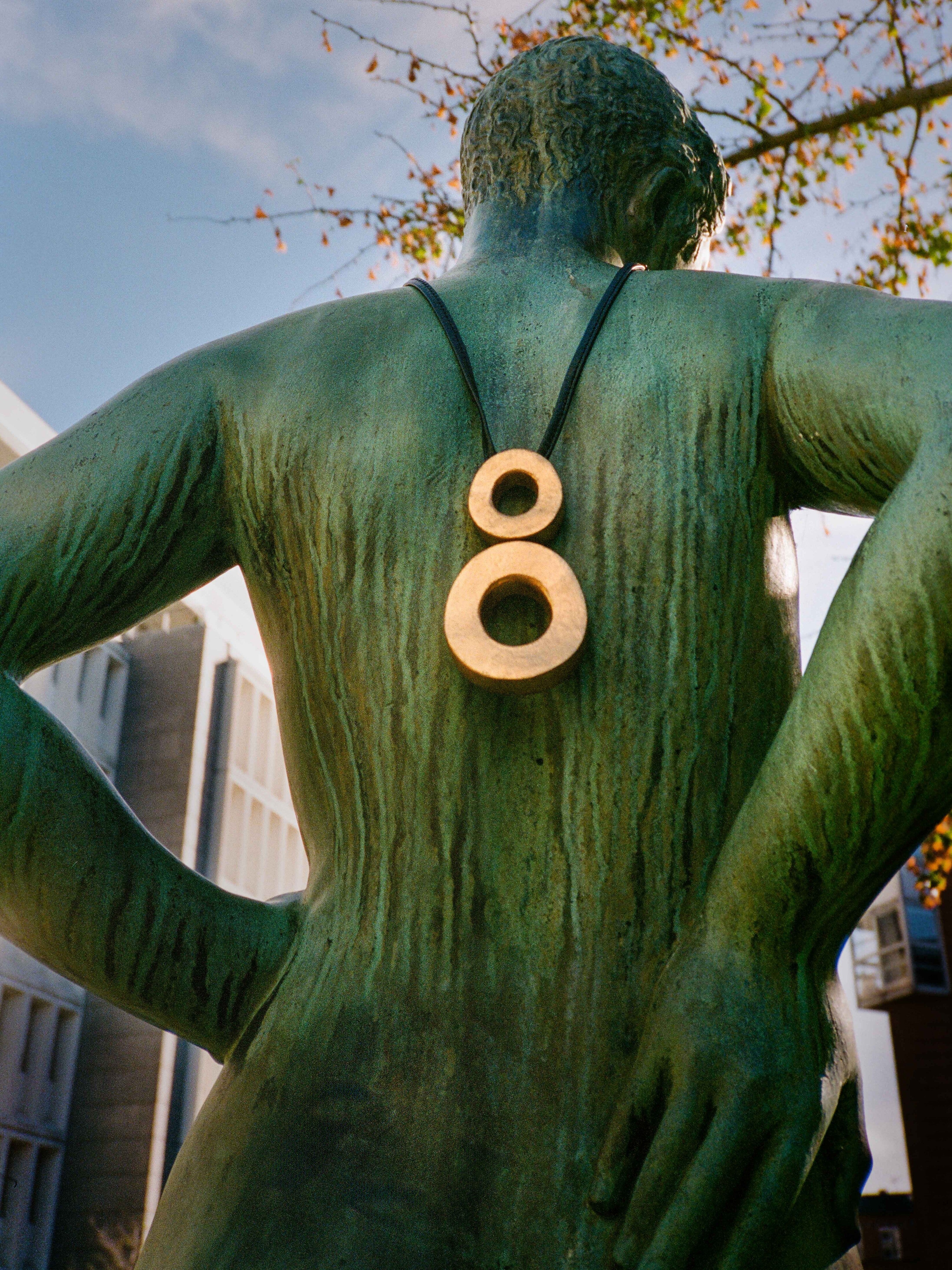 Eska pendant: acacia, goldfoil, leather