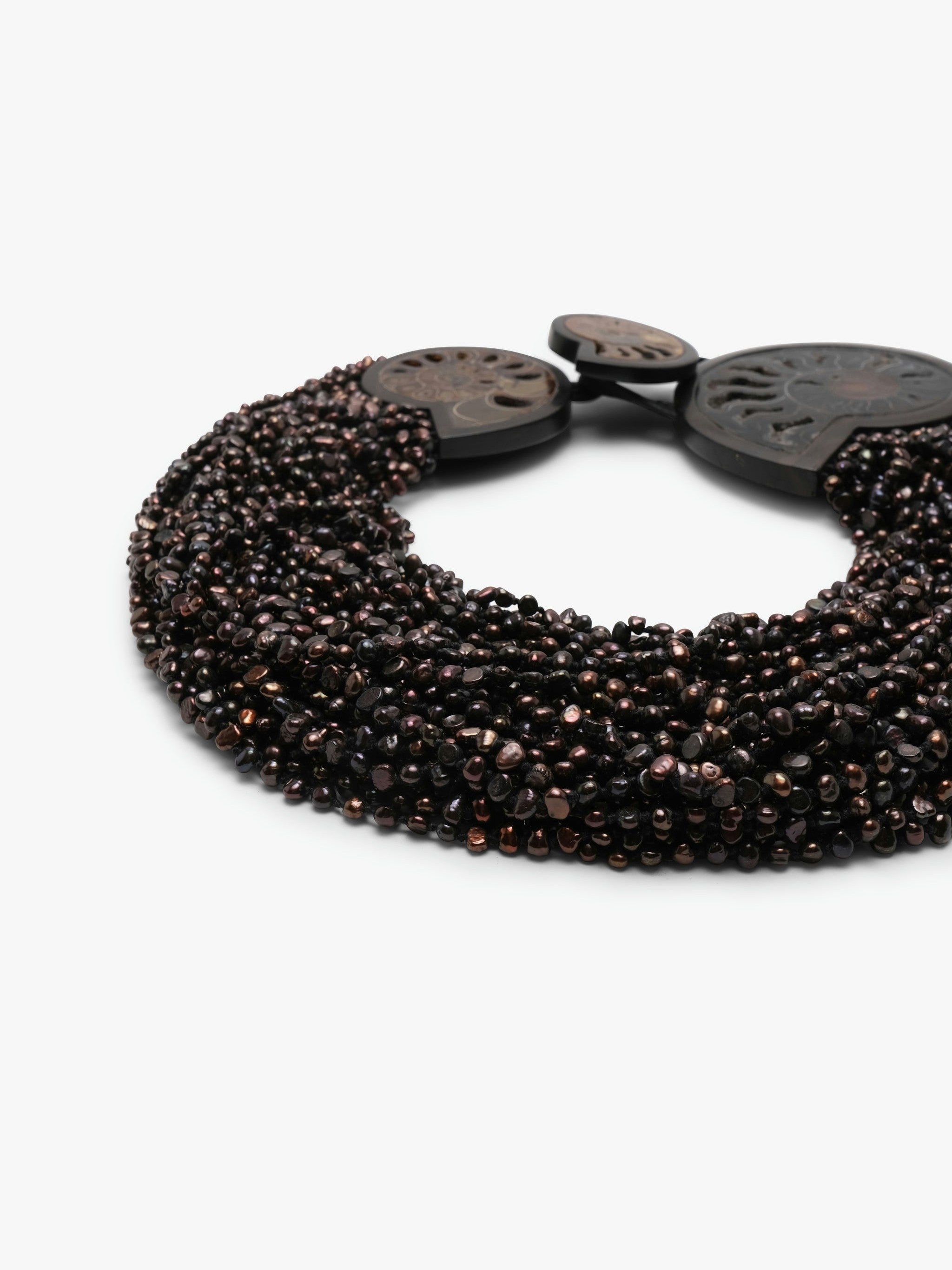 Necklace: amonite, ebony, pearls, leather
