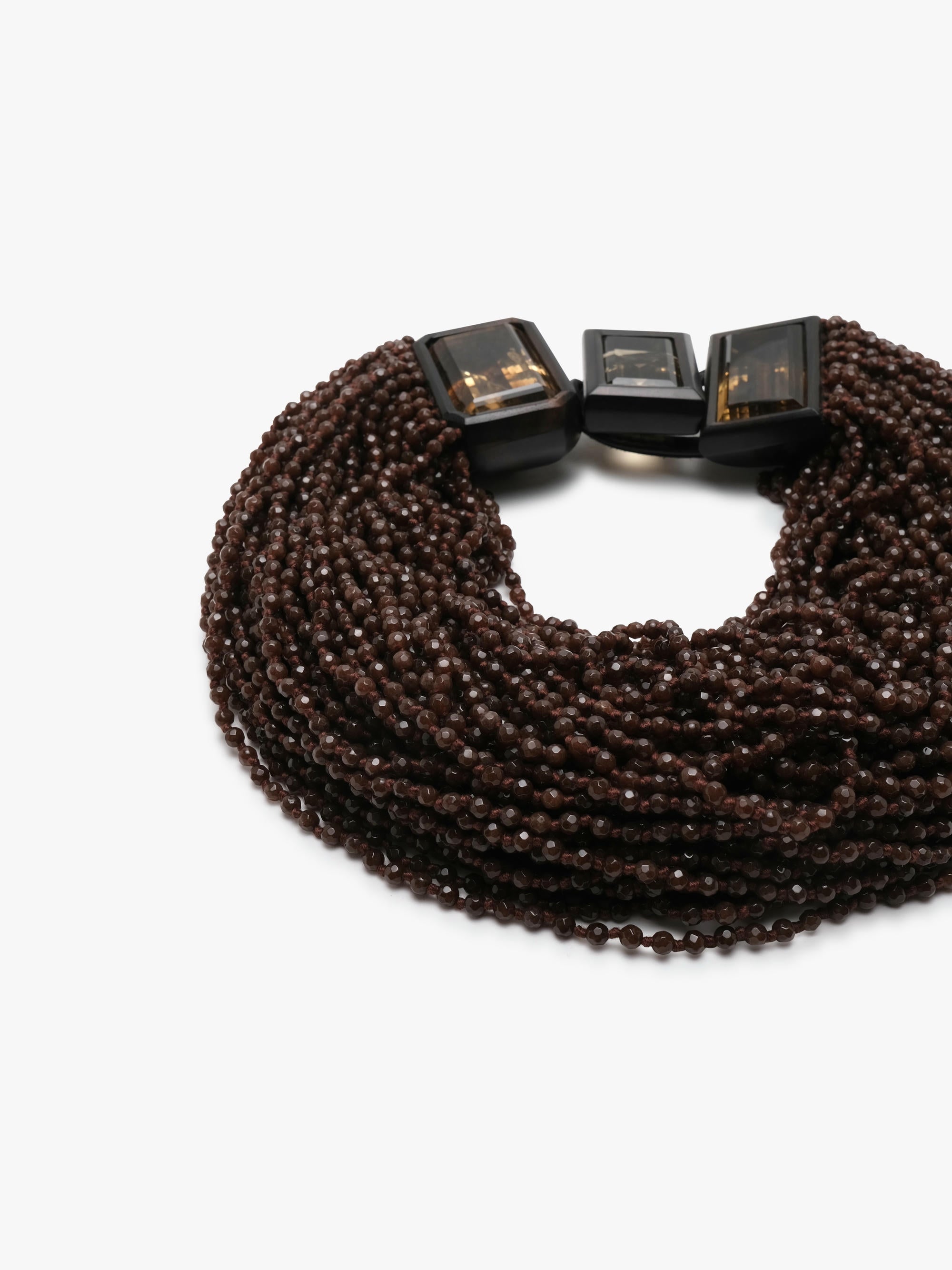 multistrand necklace with aventurine, citrne and ebony on a white background. 