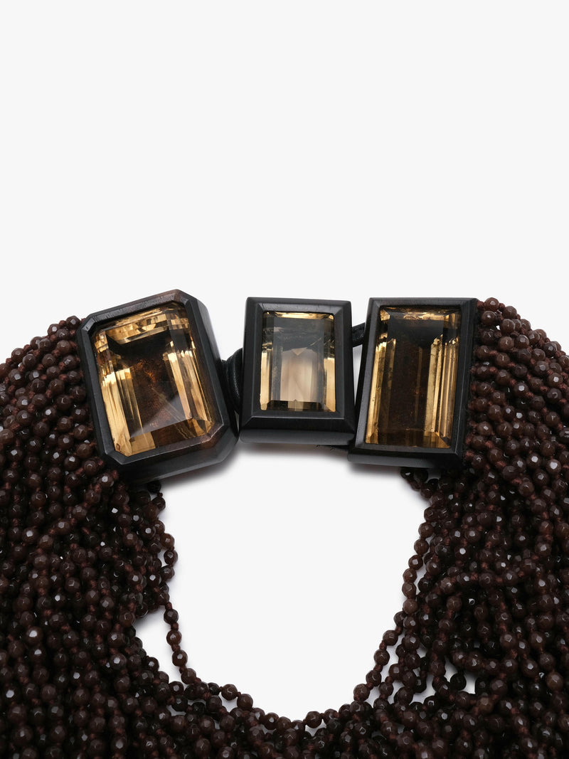 multistrand necklace with aventurine, citrne and ebony on a white background. 
