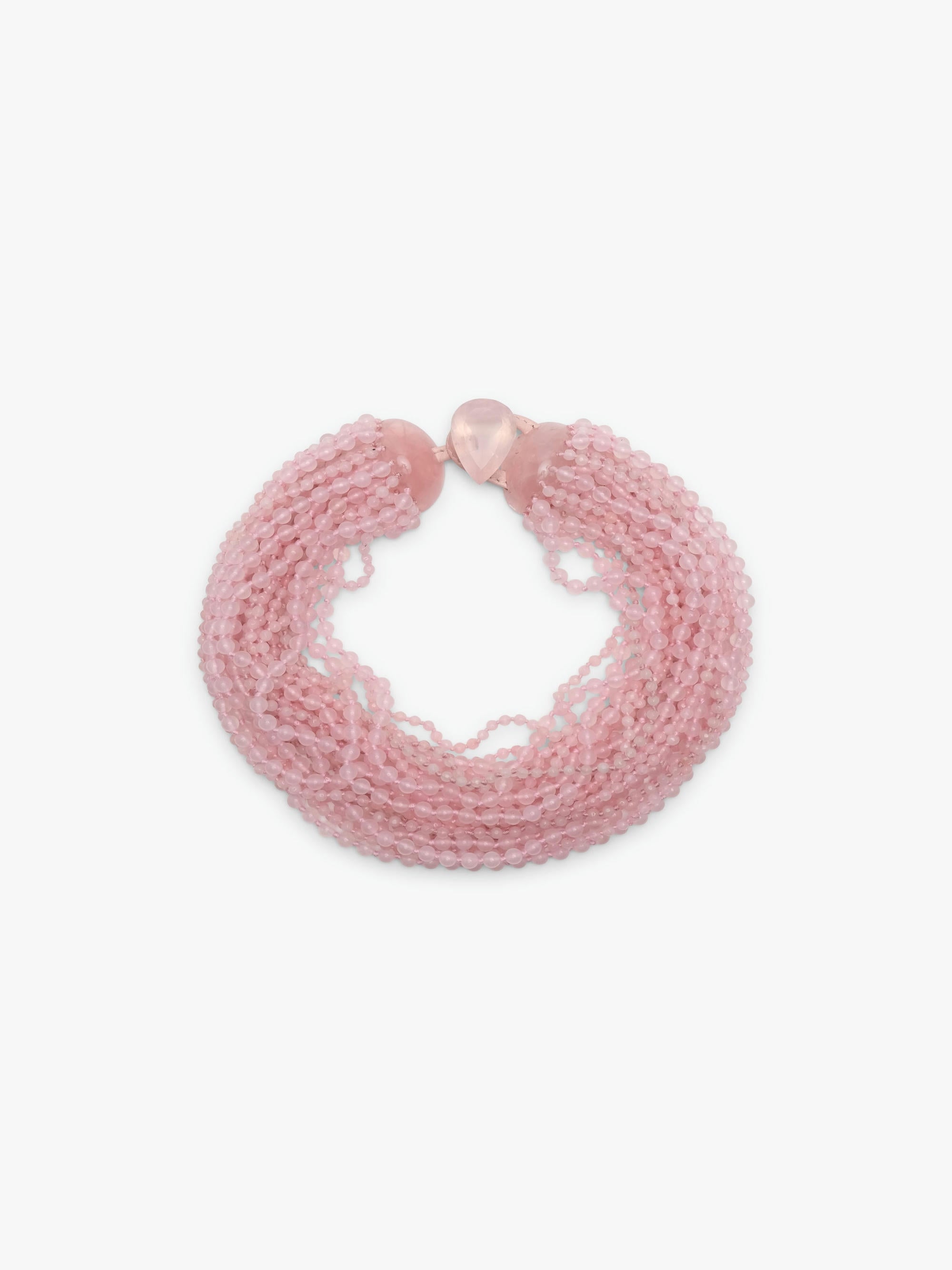 A multi-strand pink beaded wrap necklace with a small pink heart charm, displayed on a clean white background.