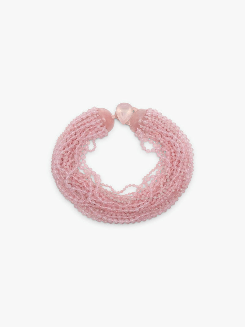 A multi-strand pink beaded wrap necklace with a small pink heart charm, displayed on a clean white background.