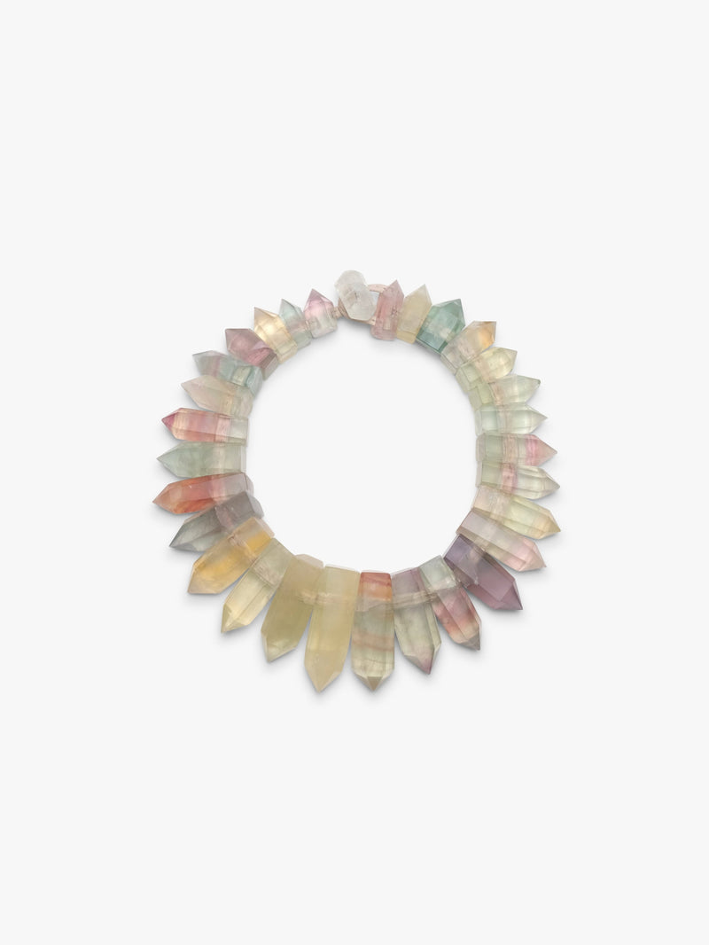 Multicolored stone necklace on a white background