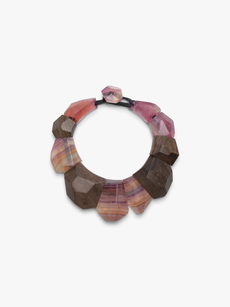Multicolored stone necklace on a white background