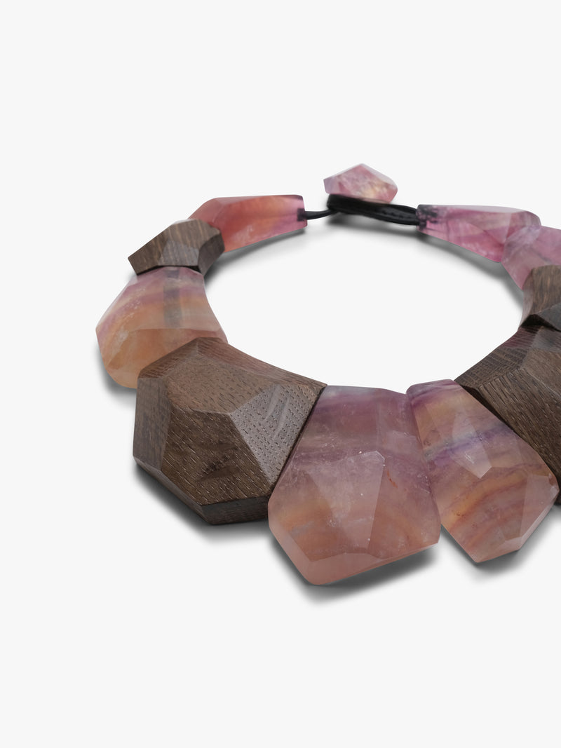 Necklace with pink and brown beads on a white background