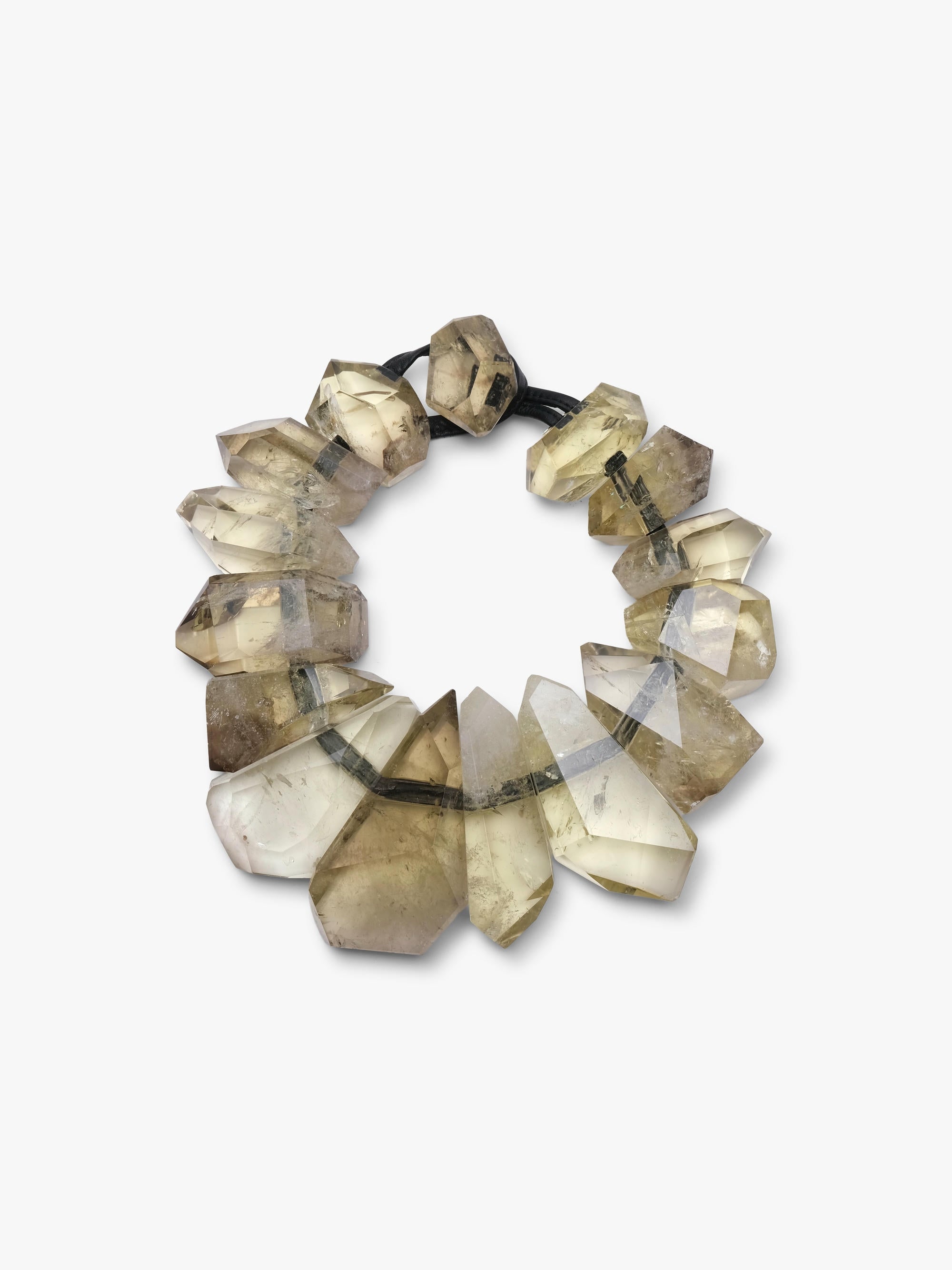  a beaded necklace featuring faceted, yellow citrine beads with natural inclusions, threaded on a black elastic band, set against a plain white background.