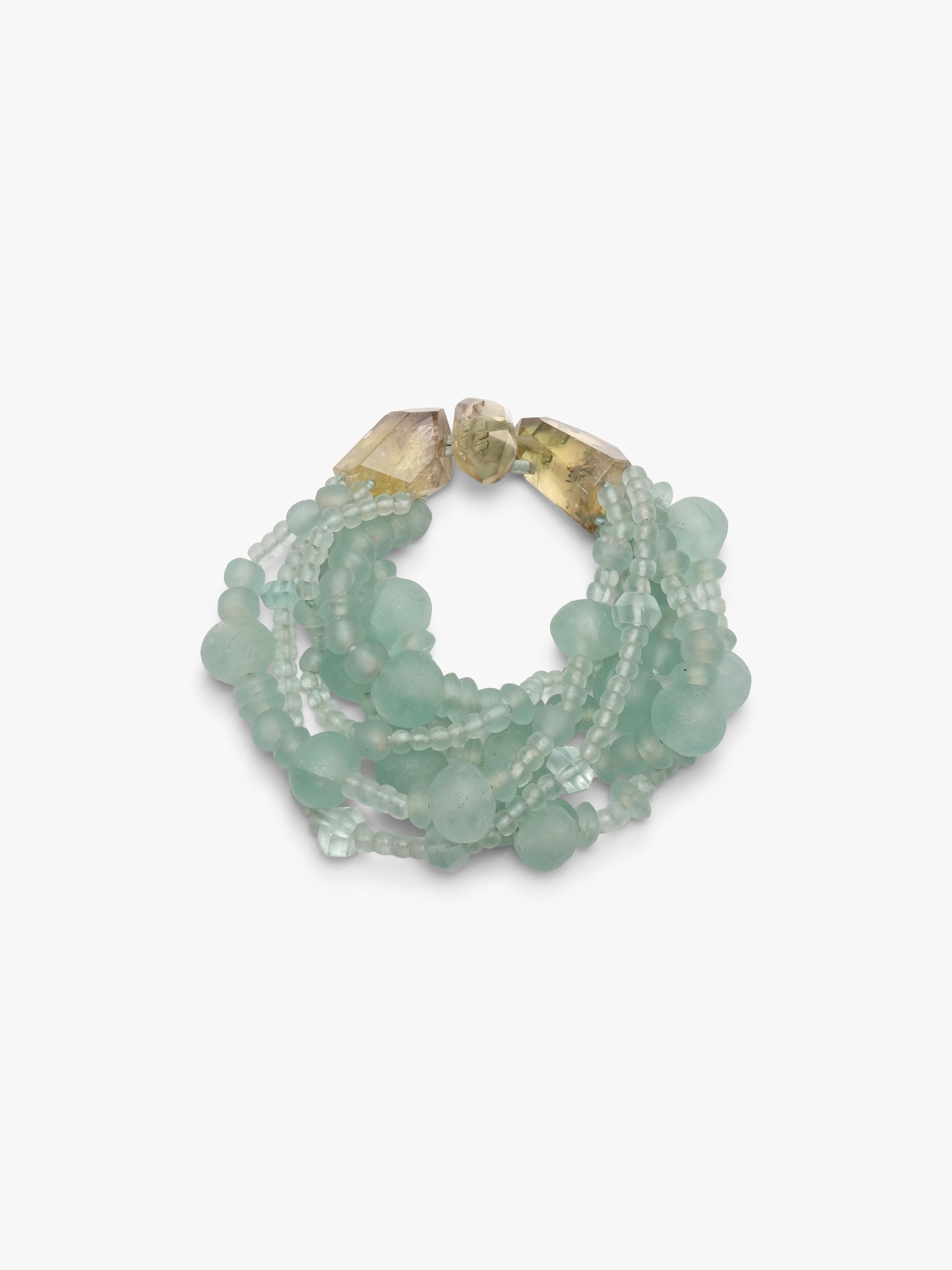 multistrand necklace with green glass beads and citrine closure.