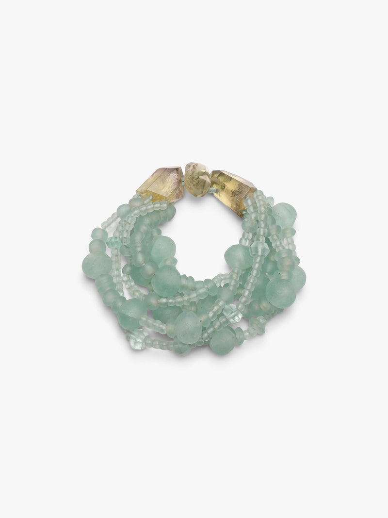 multistrand necklace with green glass beads and citrine closure.