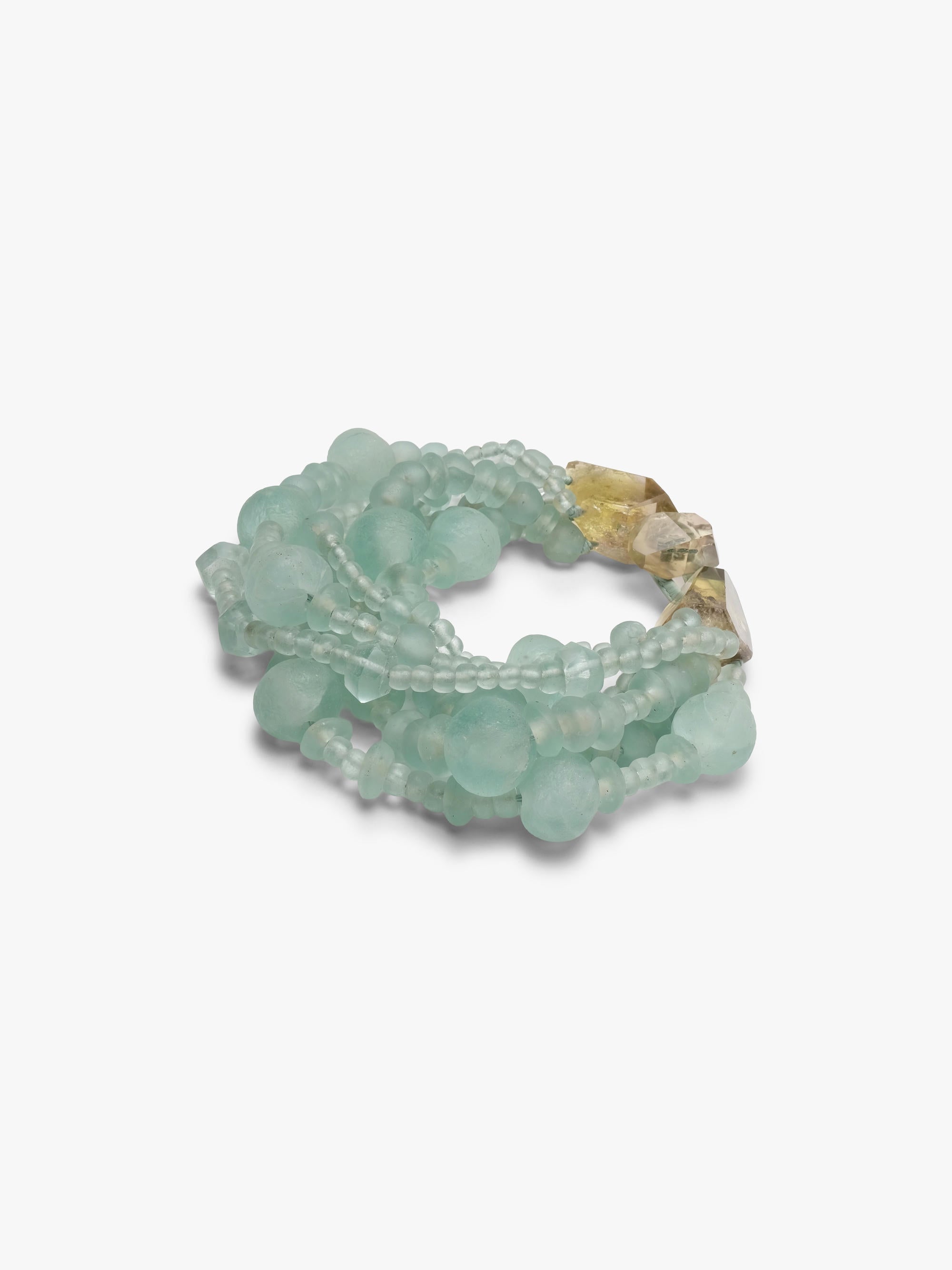 multistrand necklace with green glass beads and citrine closure.