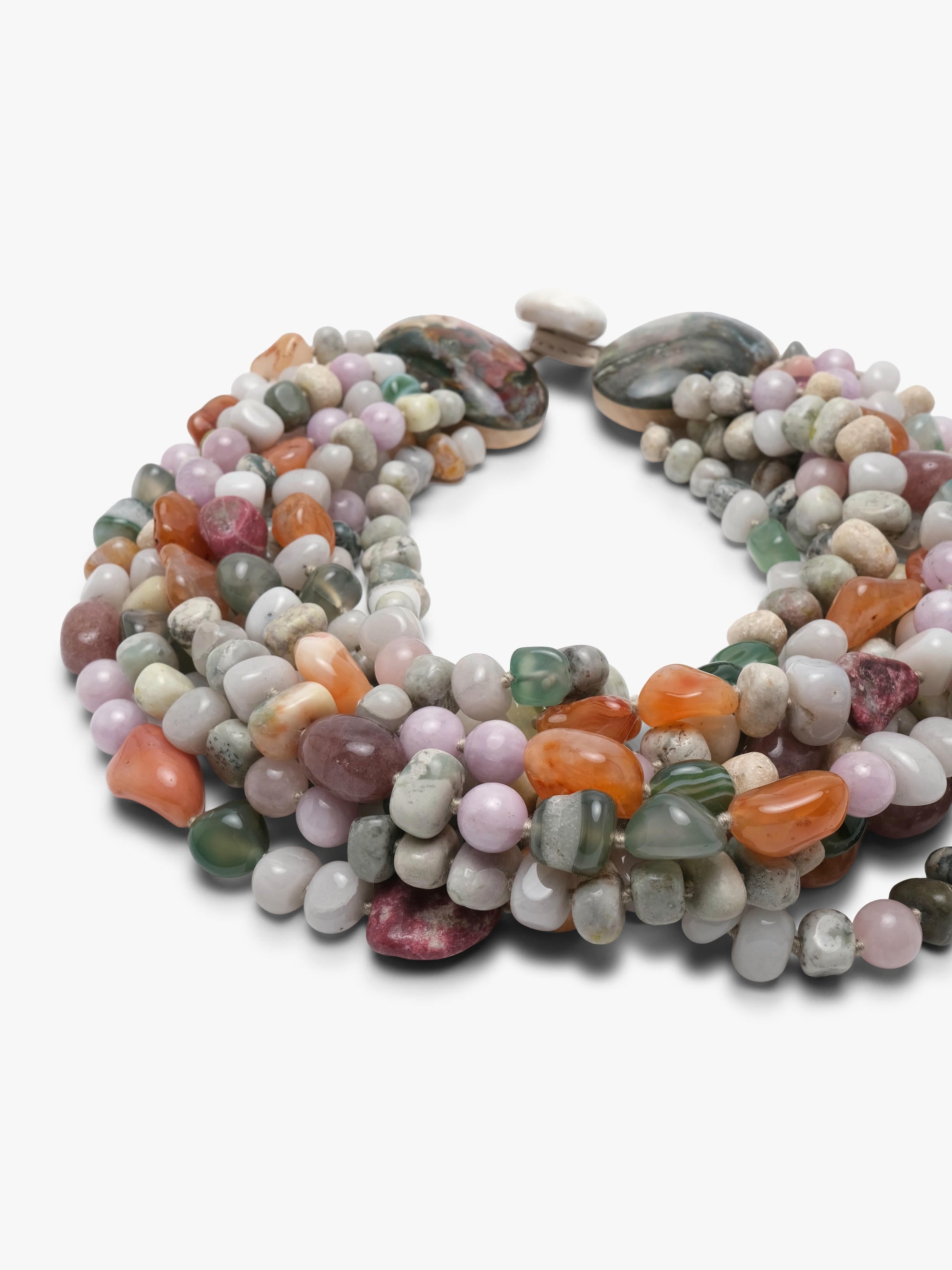 A multi-strand beaded necklace made of polished gemstone chips in various colors including pink, green, orange, gray, and white, arranged in a circular shape on a plain white background.