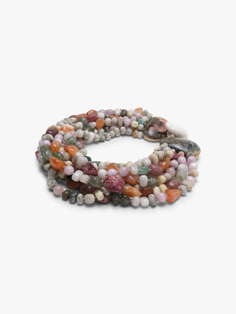 A multi-strand beaded necklace made of polished gemstone chips in various colors including pink, green, orange, gray, and white, arranged in a circular shape on a plain white background.