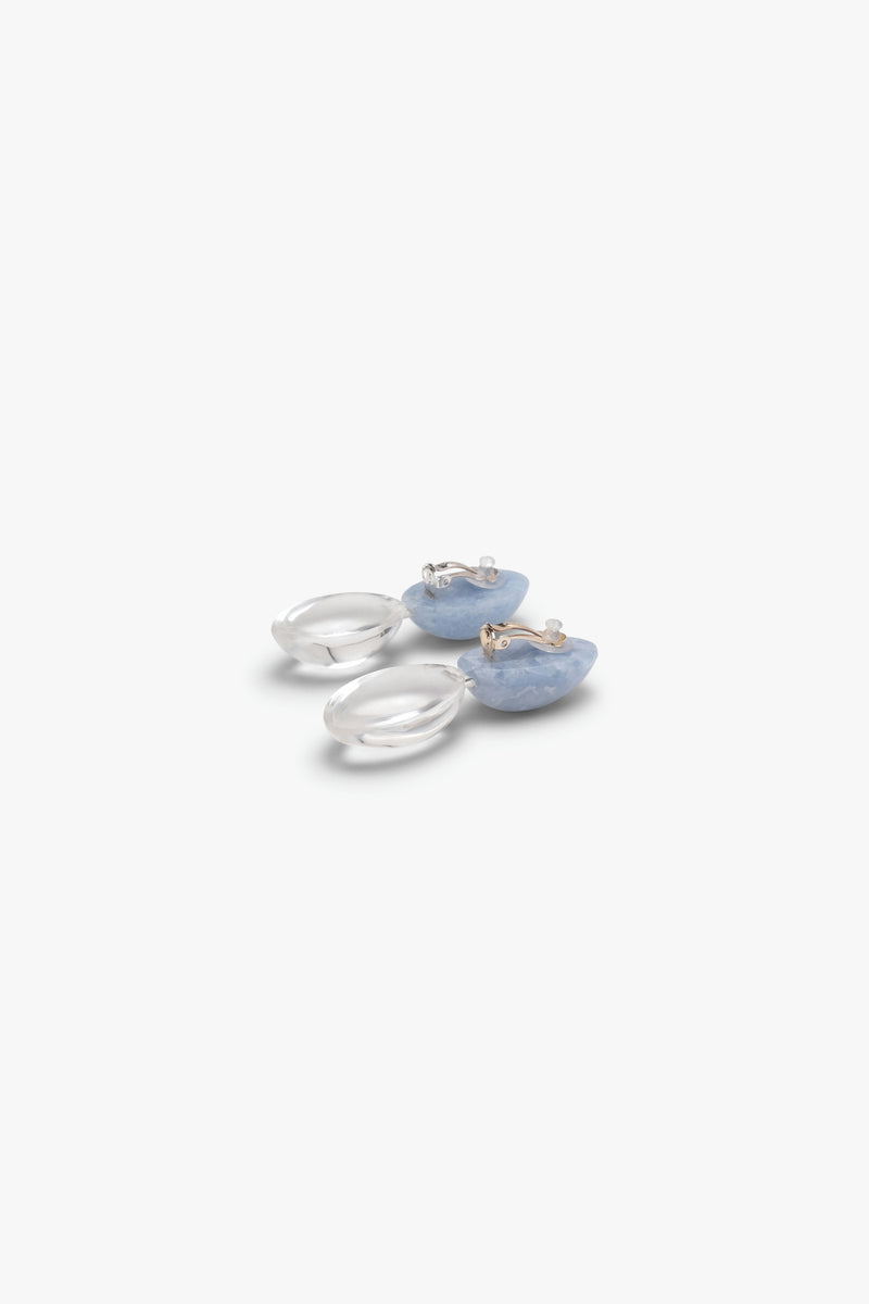 Blue and clear earrings displayed on a white background