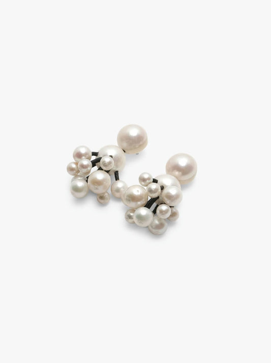 Stud earrings: pearls, leather
