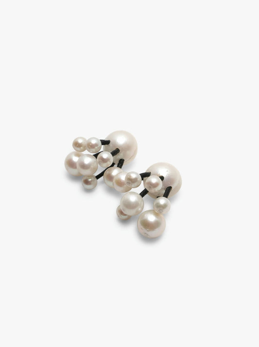 Stud earrings: pearls, leather