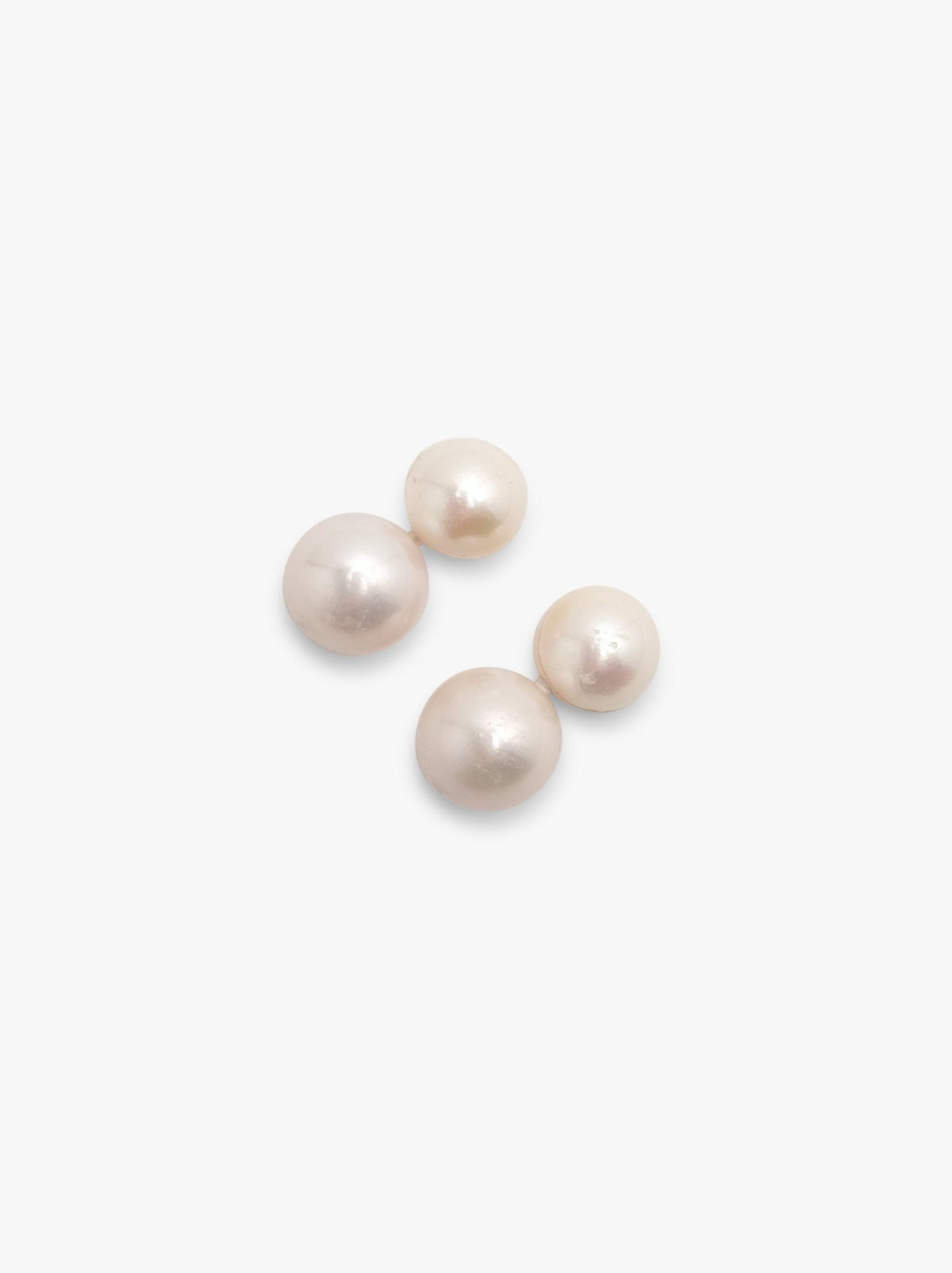 Stud earrings: pearls, horn