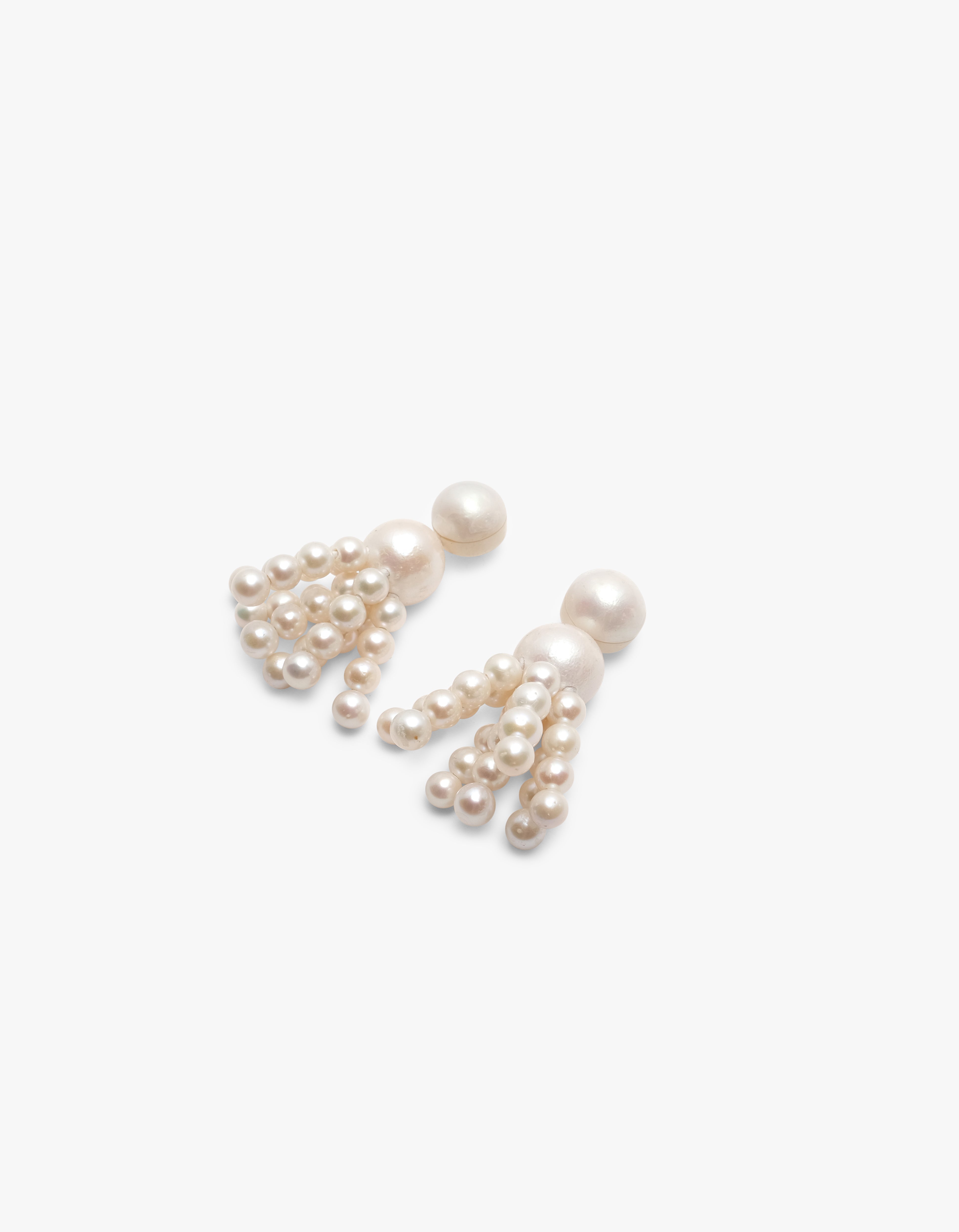 Earrings: freshwater pearls, horn