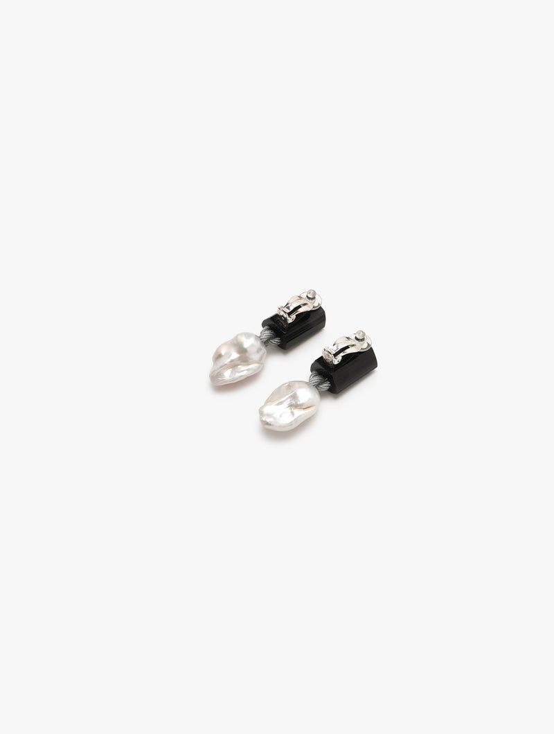 black earrings with baroque pearl extended beneath, displayed on a white background