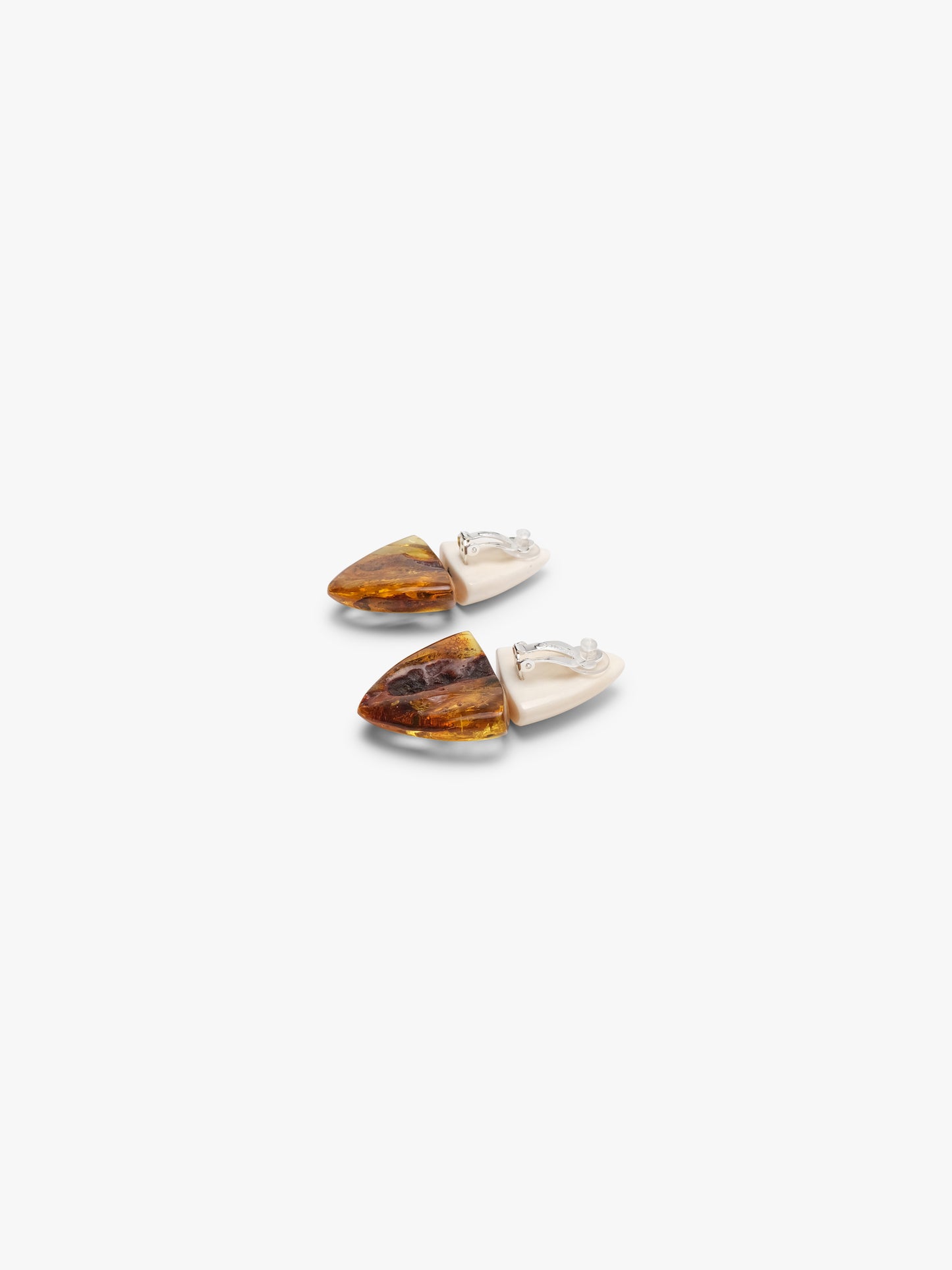 Earrings: bone, amber