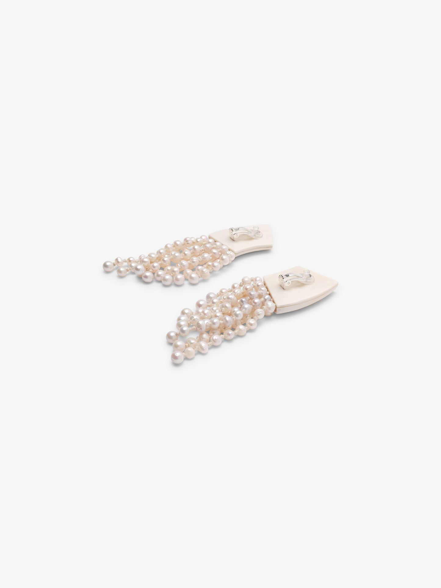 Earrings: freshwater pearls, warthog