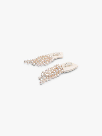 Earrings: freshwater pearls, warthog