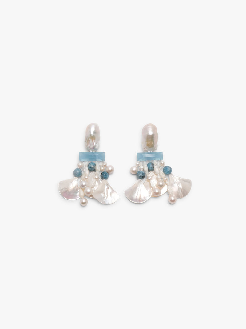 Pair of earrings with pearls and blue stones on a white background