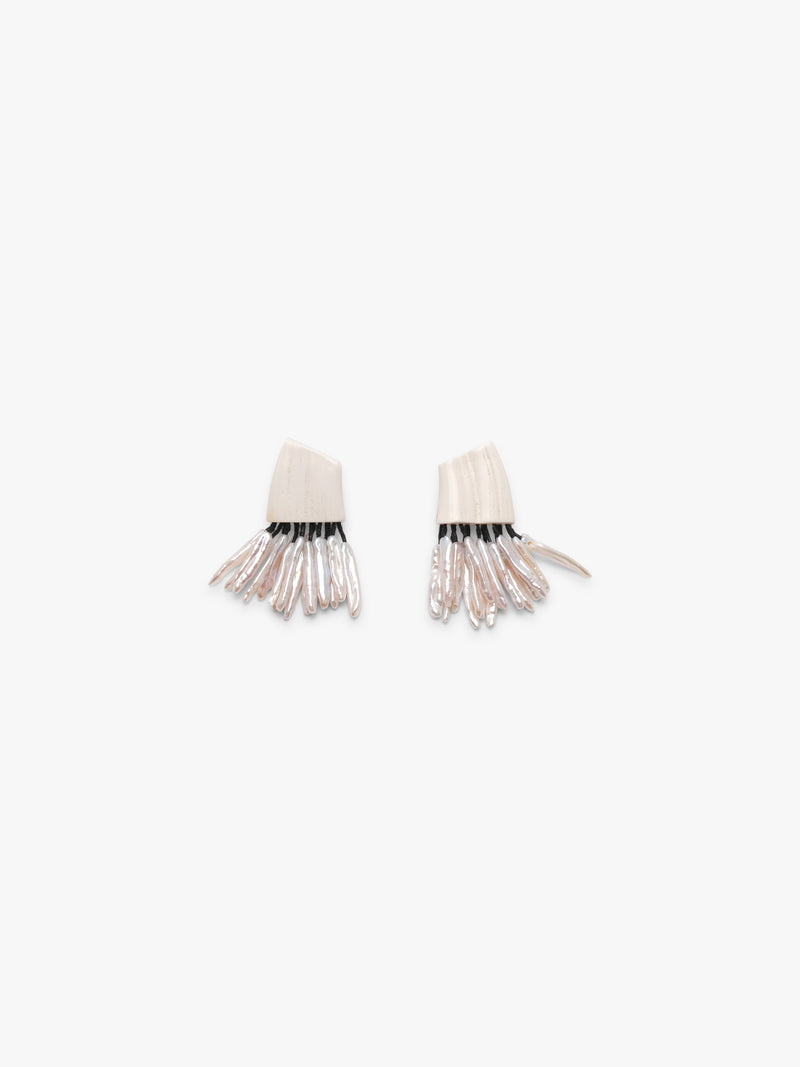 Earrings: freshwater pearls, warthog bone