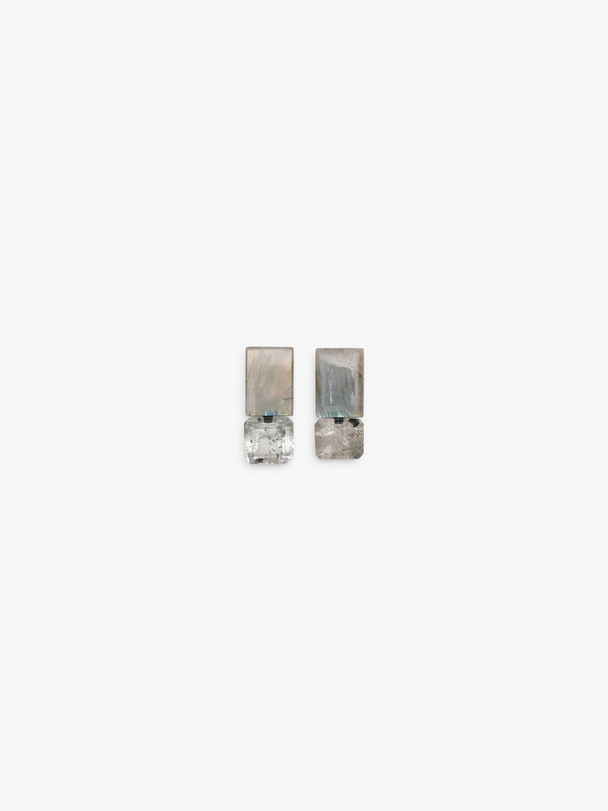 Pair of silver earrings made of quartz and labradroite on a white background
