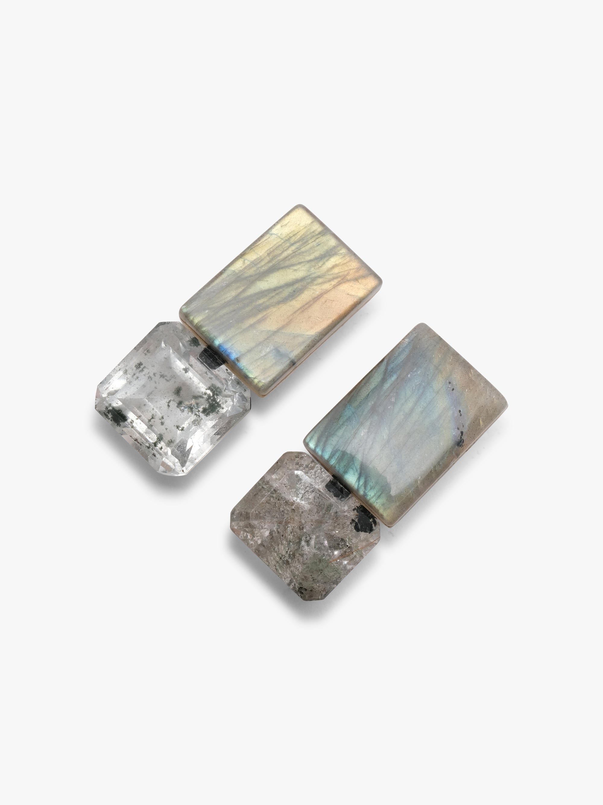 Pair of silver earrings made of quartz and labradroite on a white background