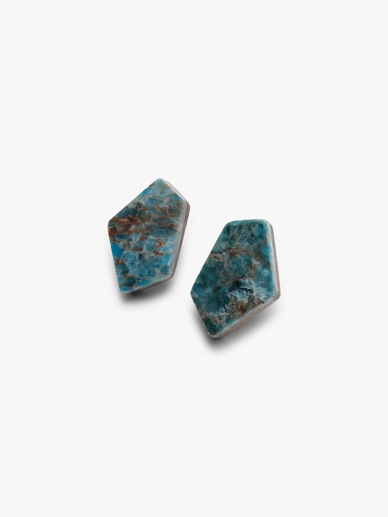 Pair of blue stone earrings on a white background