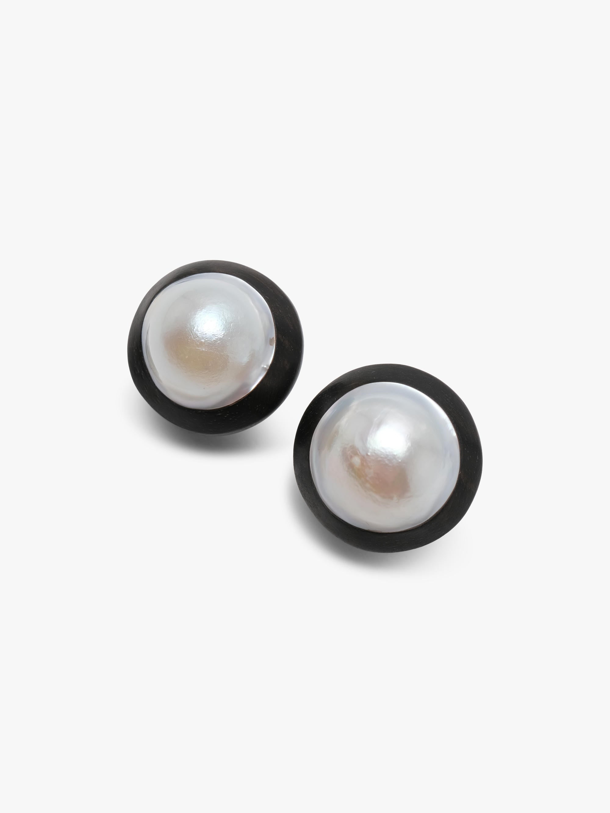Earrings: baroque pearls, ebony