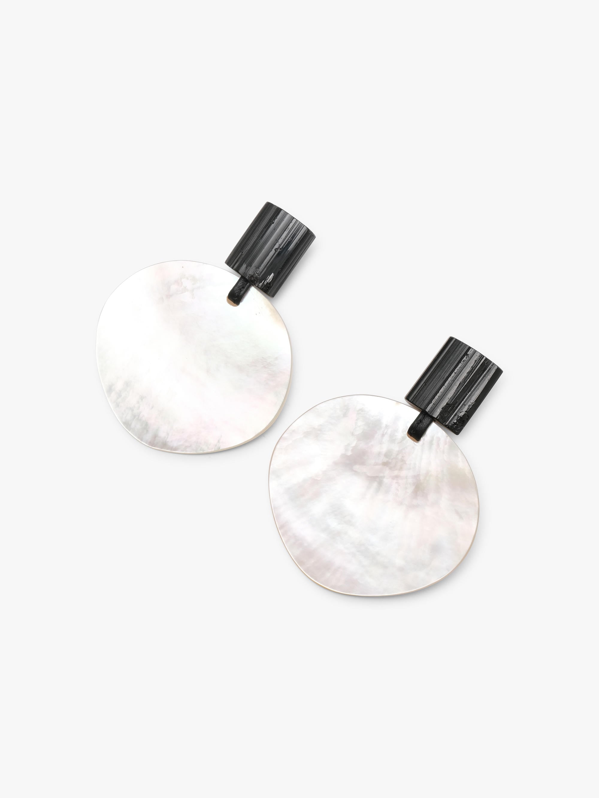 Pair of earrings with round white pearl and black tourmaline on a white background