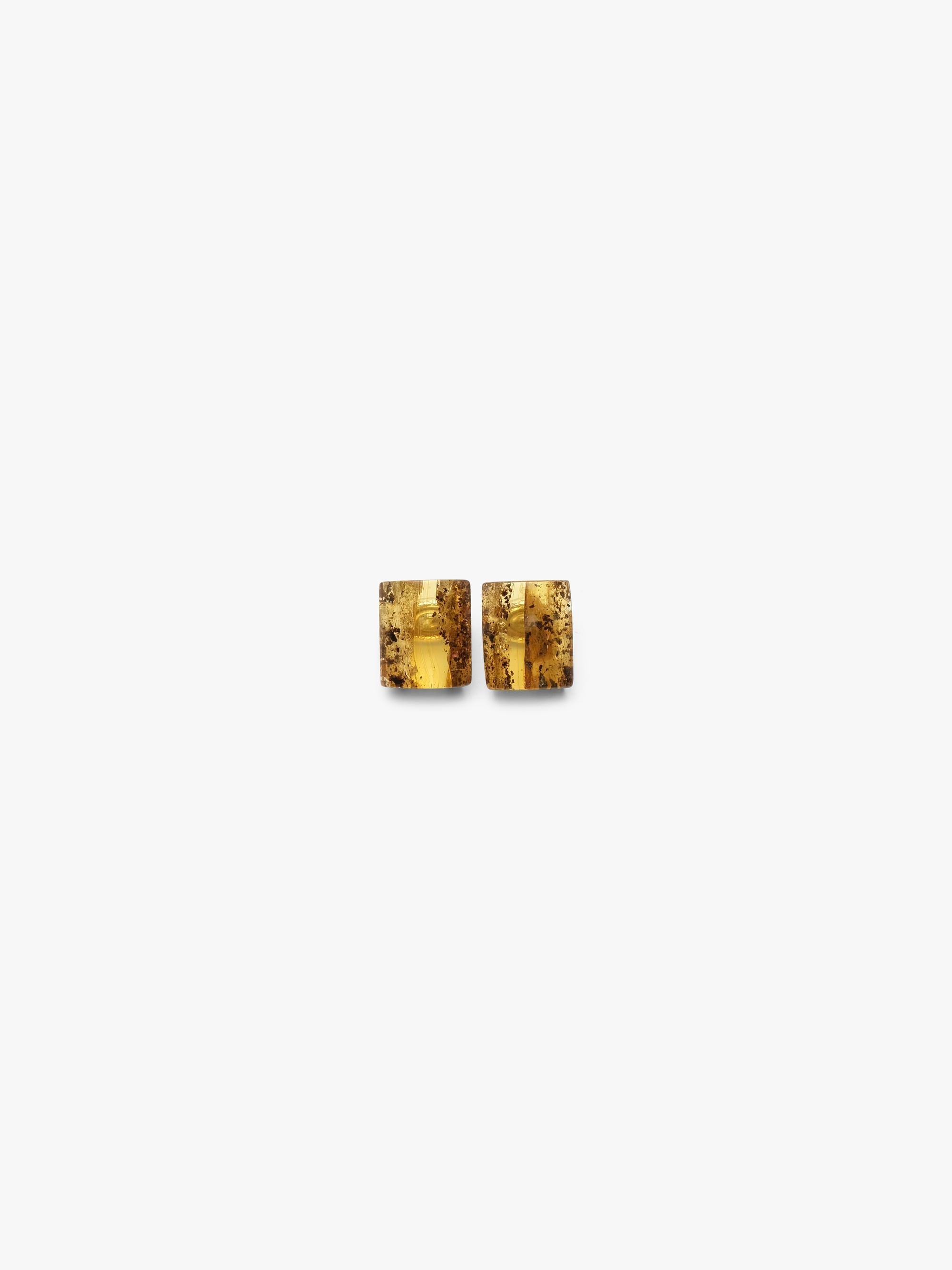 amber earrings on a white background