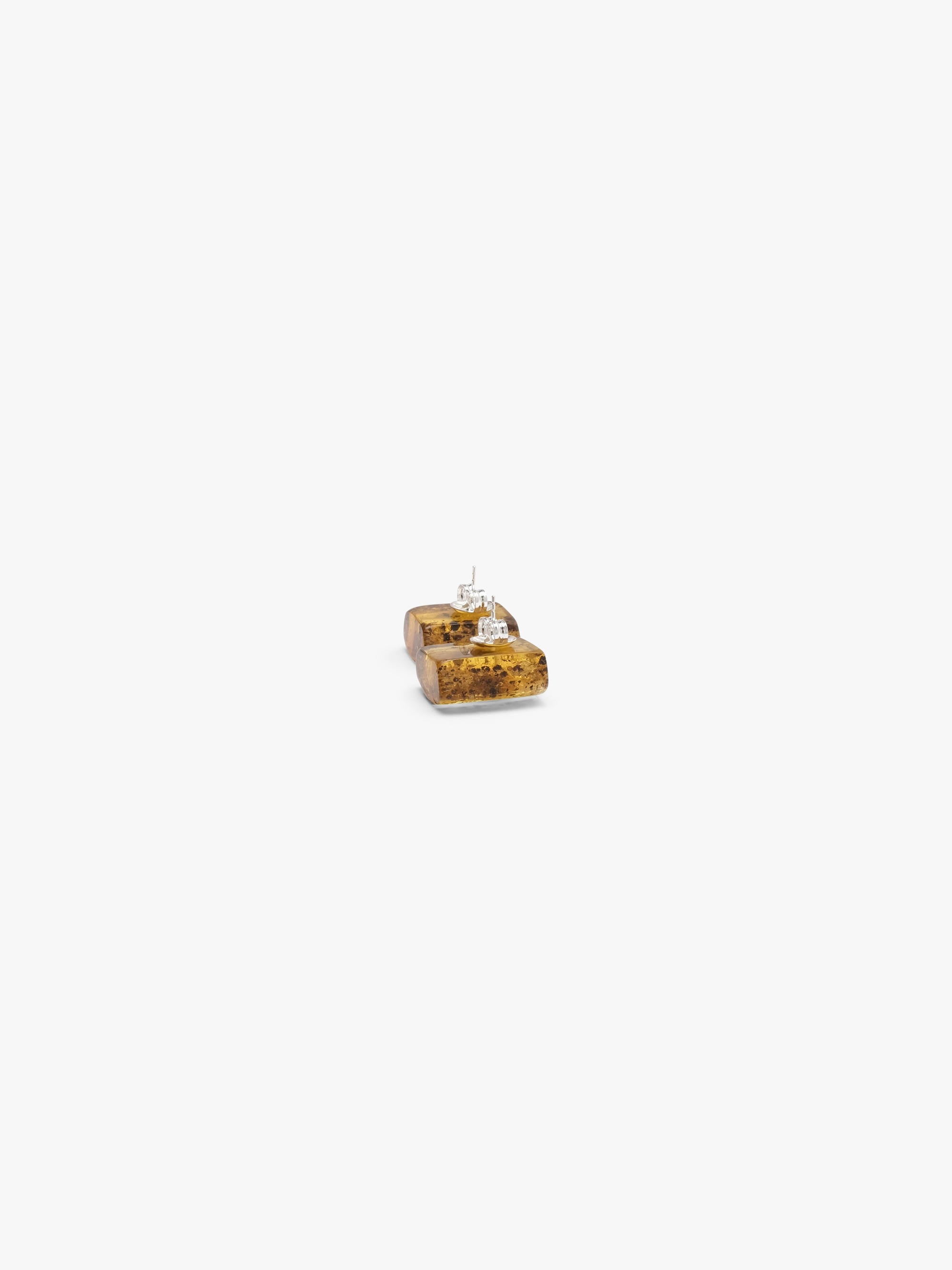 amber earrings on a white background