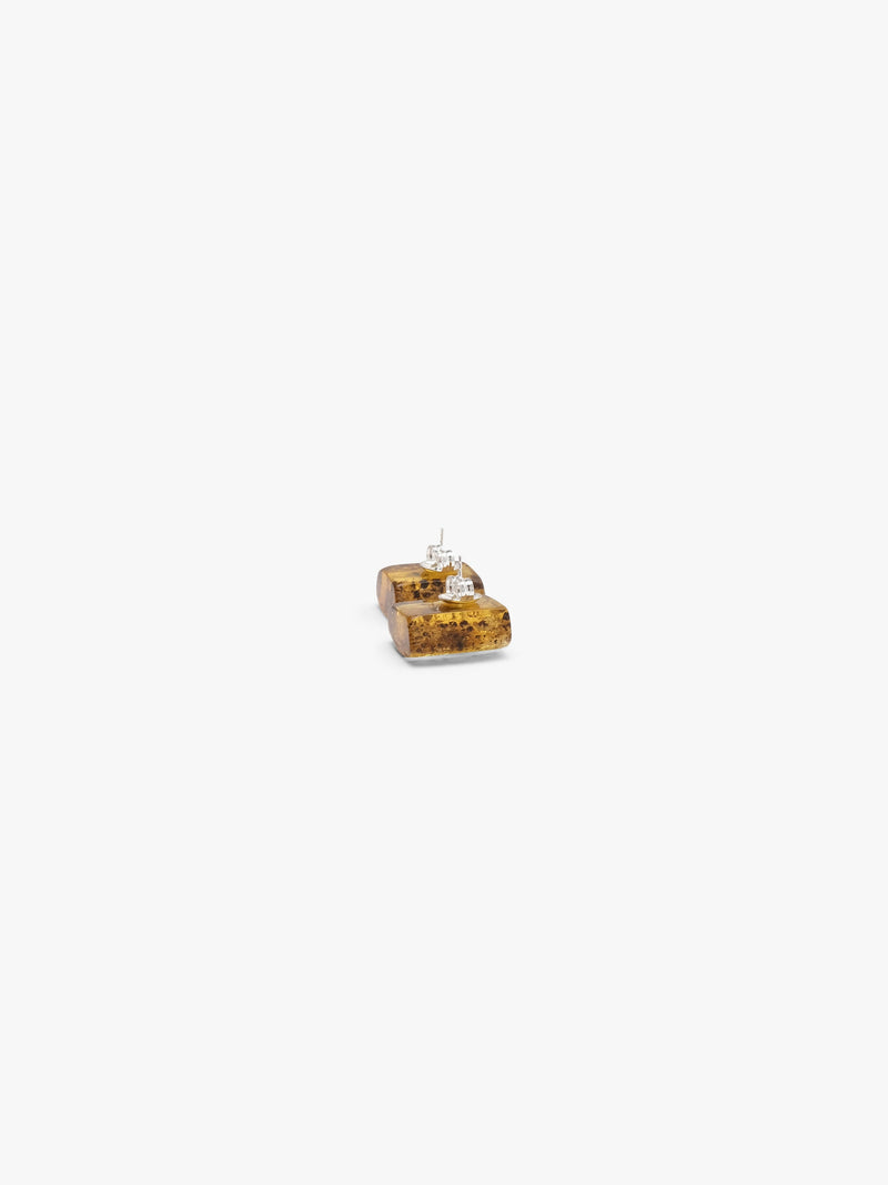 amber earrings on a white background