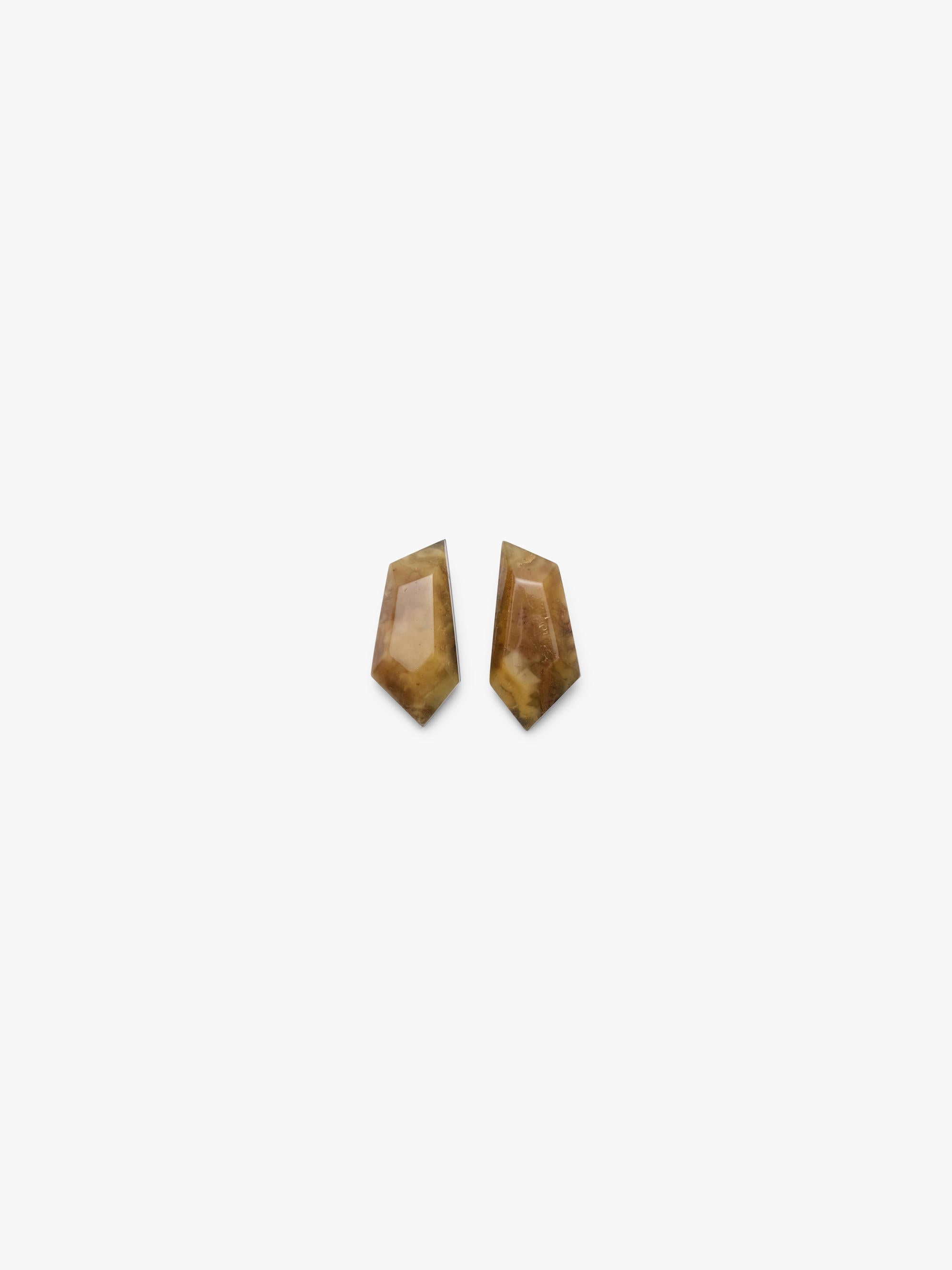 Two brown amber earrings on a white background