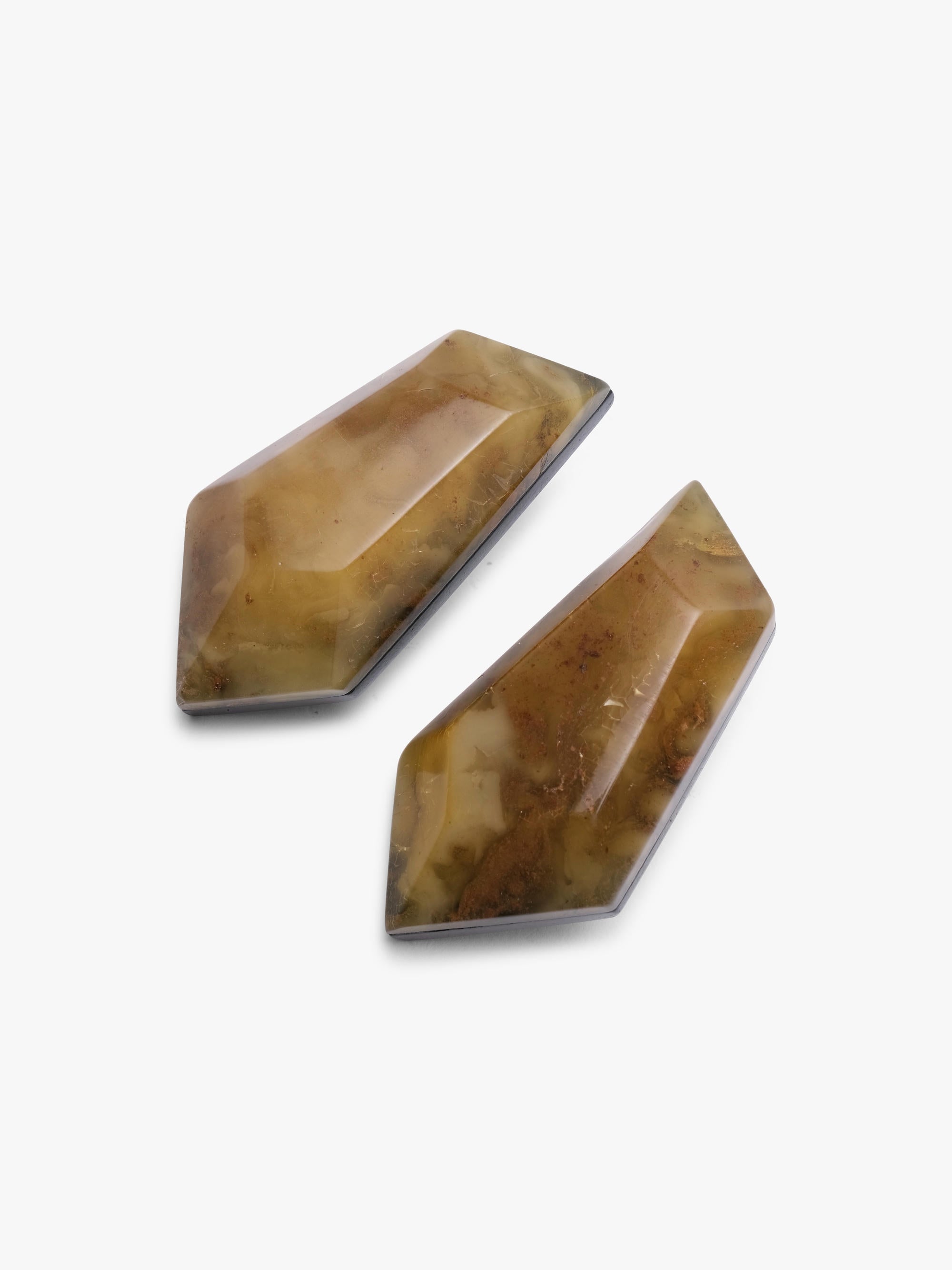 Two brown amber earrings on a white background