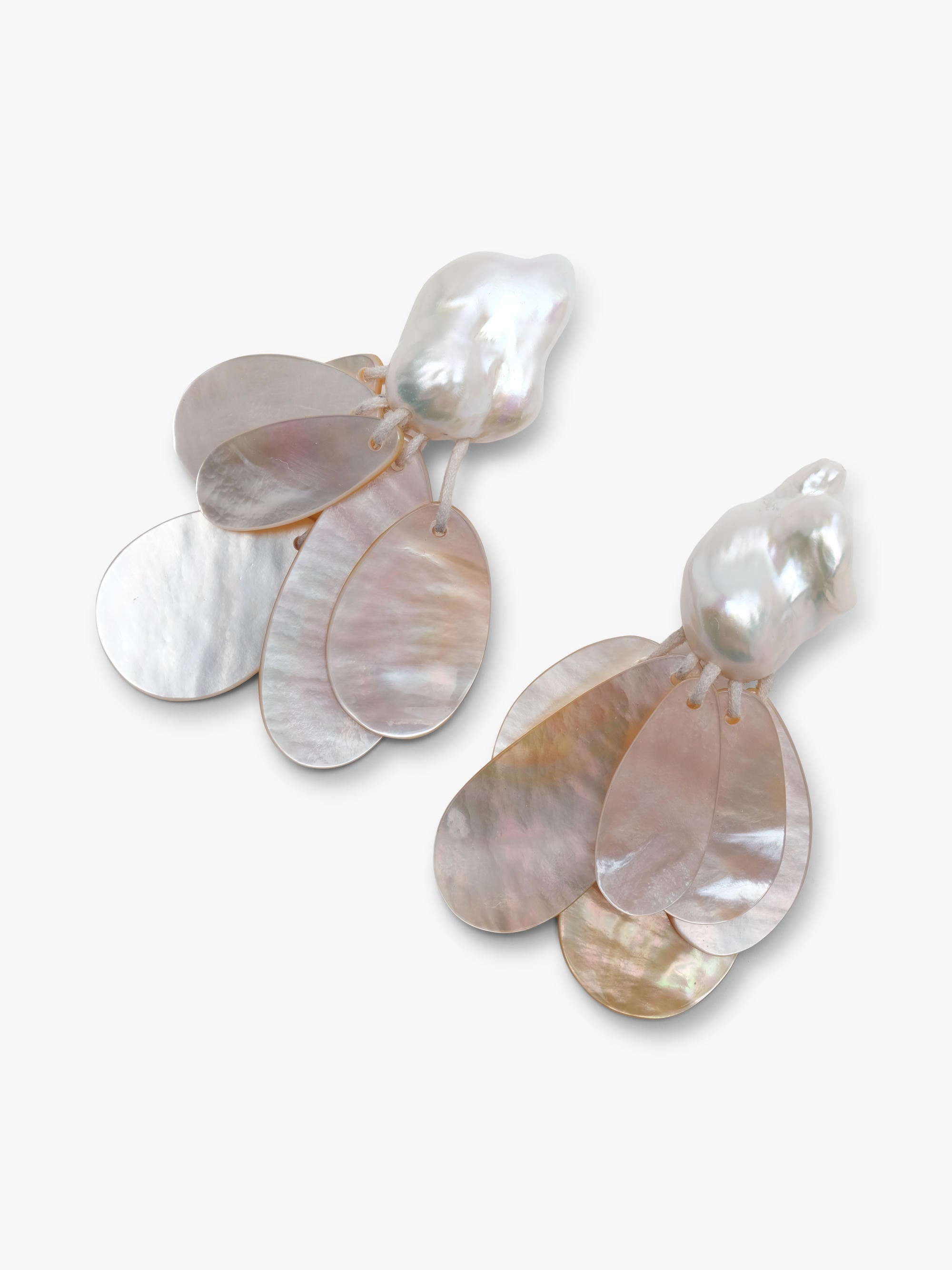 earrings with baroque pearls and mother of pearl on a white background