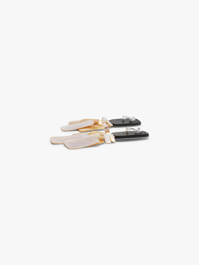 Pair of earrings with pearl design on a white background