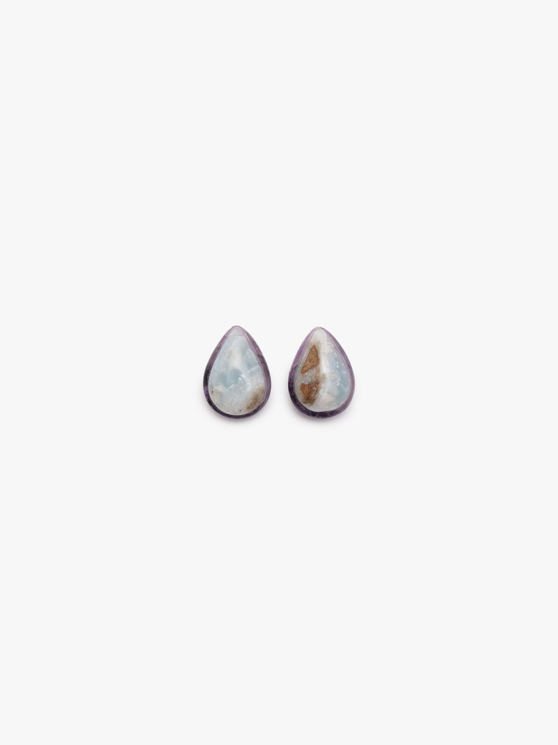teardrop shaped earrings with blue, purple and brown hues on a white background