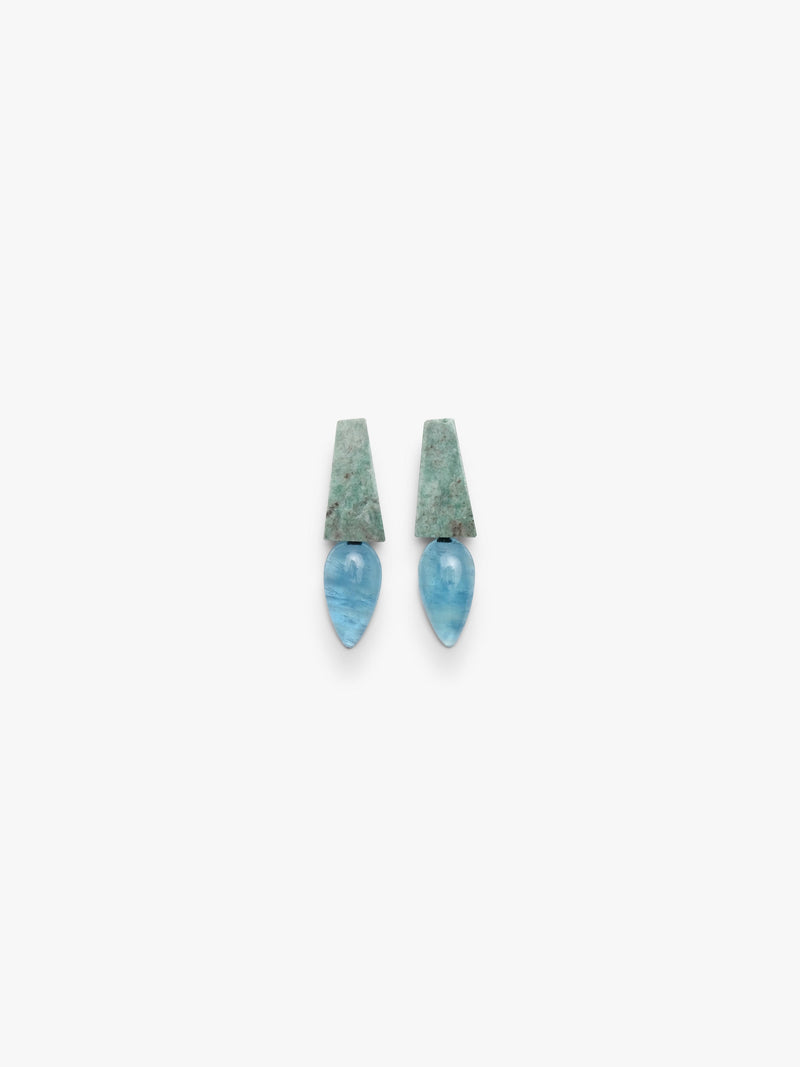 A pair of drop earrings featuring textured, mossy green rectangular studs with smooth, teardrop-shaped light blue stone drops below, set against a plain off-white background.
