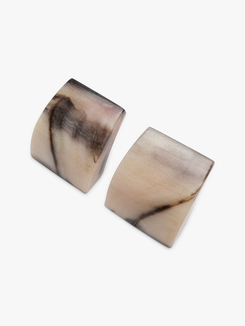 Square earrings with white and brown details on a white background