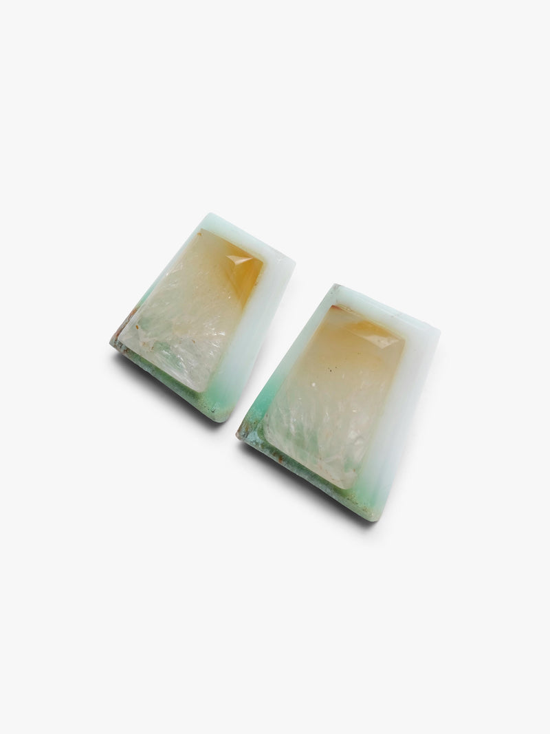 A pair of rectangular resin earrings with a layered design featuring a light green border, a textured cream center, and a warm amber-yellow top layer, shown on a plain white background.