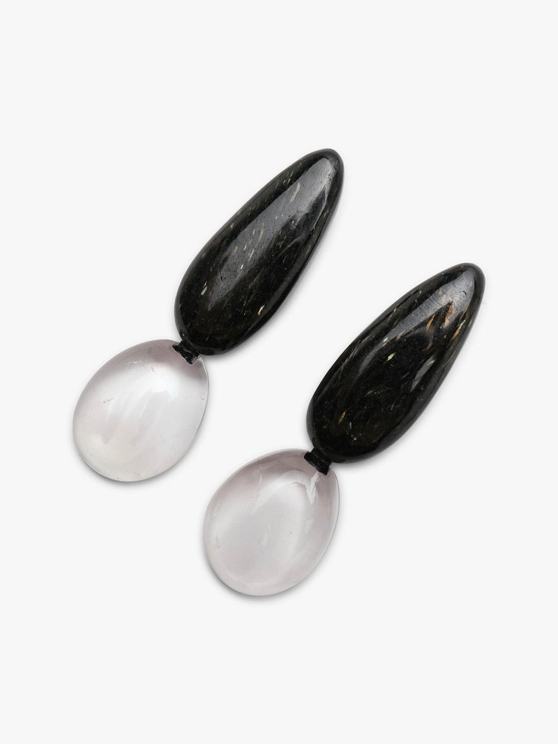 A pair of drop earrings featuring polished black obsidian teardrop pendants suspended from smooth, milky white rose quartz oval drops, shown on a clean white background.