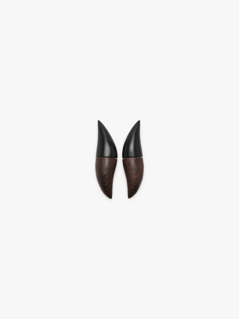 A pair of pointed black and dark brown wood earrings, displayed on a clean white background.
