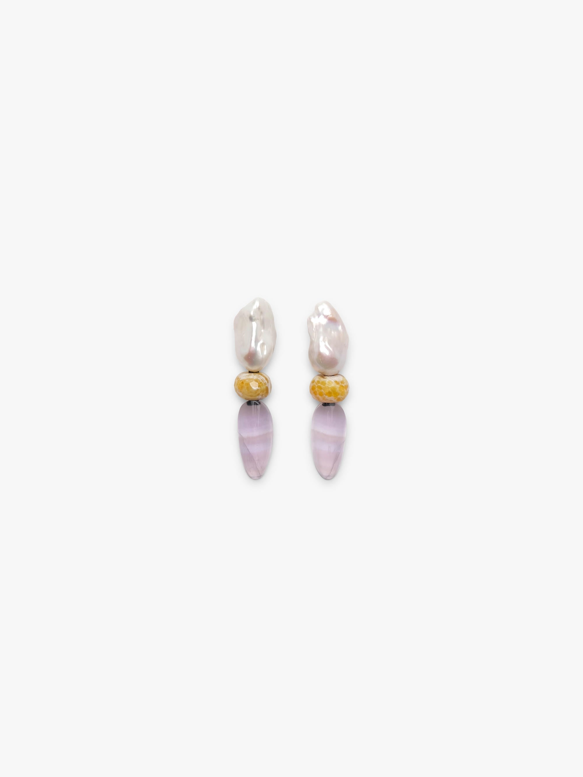 Baroque pearl earrings with rounded agate and ovalshaped flourite, displayed on a white background. 