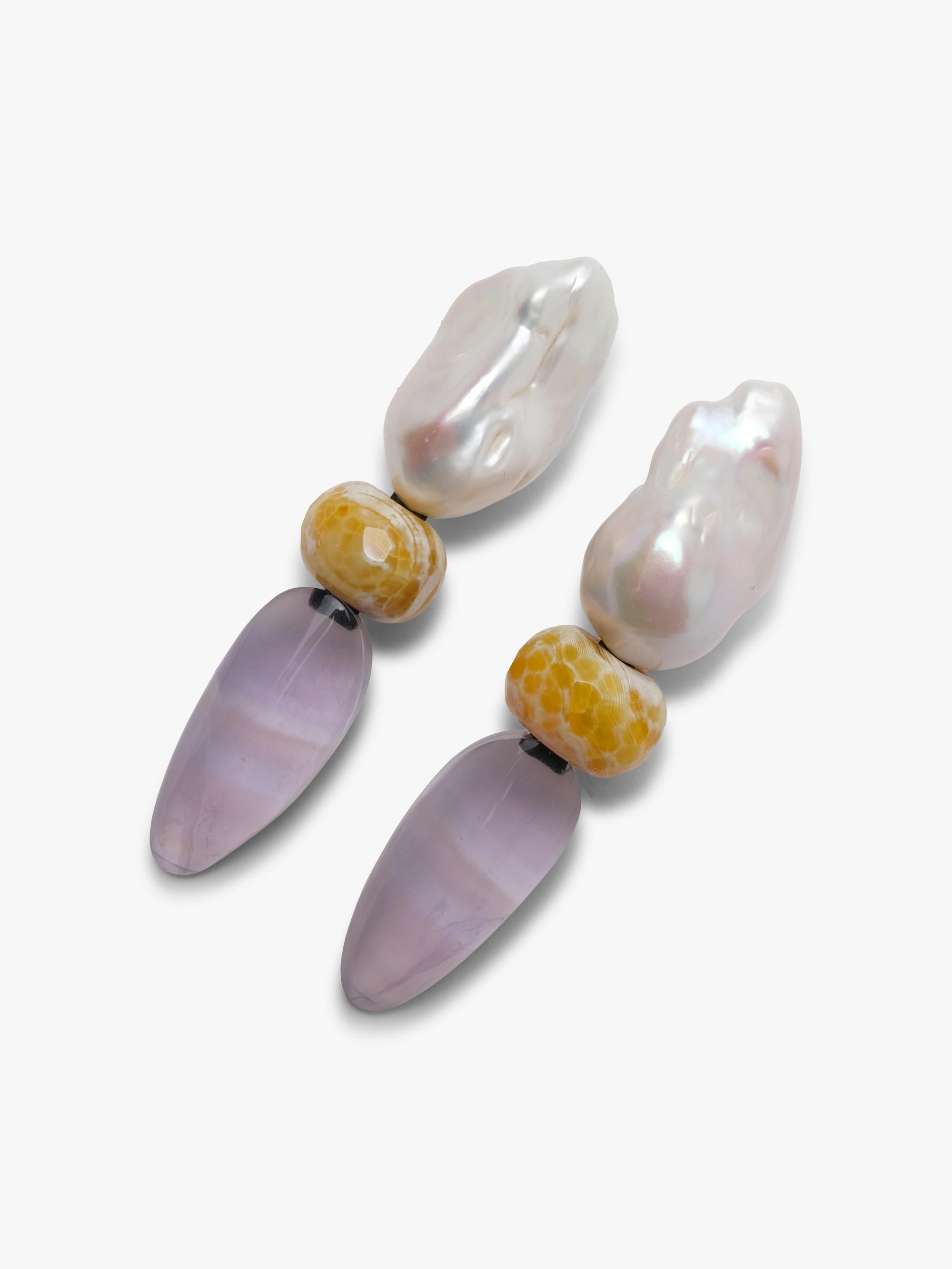 Baroque pearl earrings with rounded agate and ovalshaped flourite, displayed on a white background. 